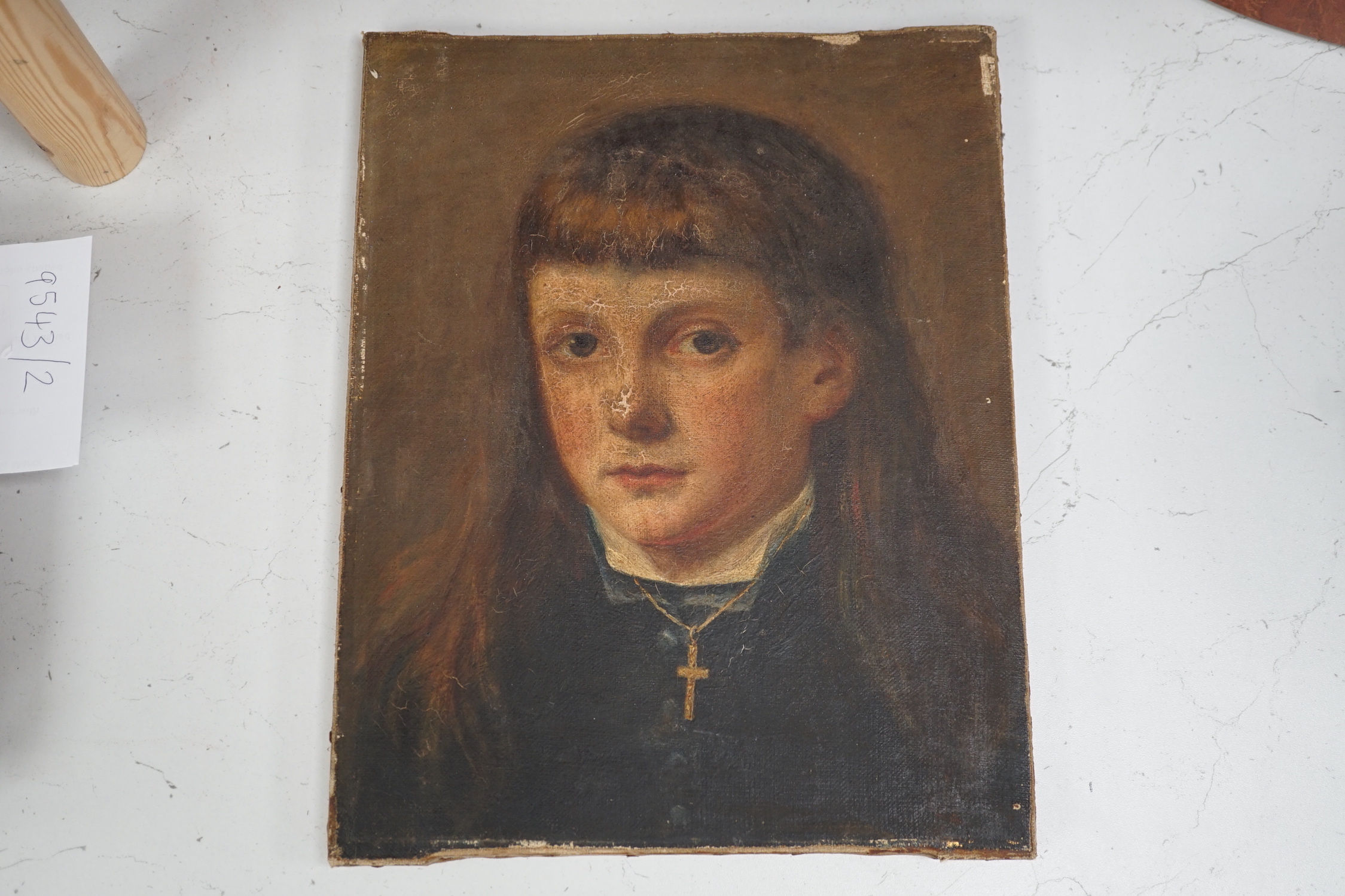 19th century English school, oil on canvas, Portrait of a youth wearing a crucifix, 34 x 27cm, unframed